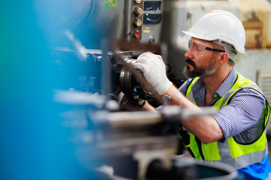 a trained member of staff following PUWER best practices whilst operating machinery